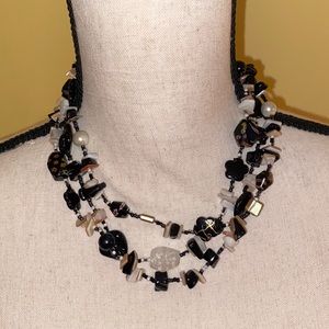 Triple strand black white and tan beaded necklace. New unused without tag.